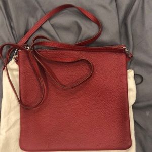 Red Cross body leather bag. Made in Paris.